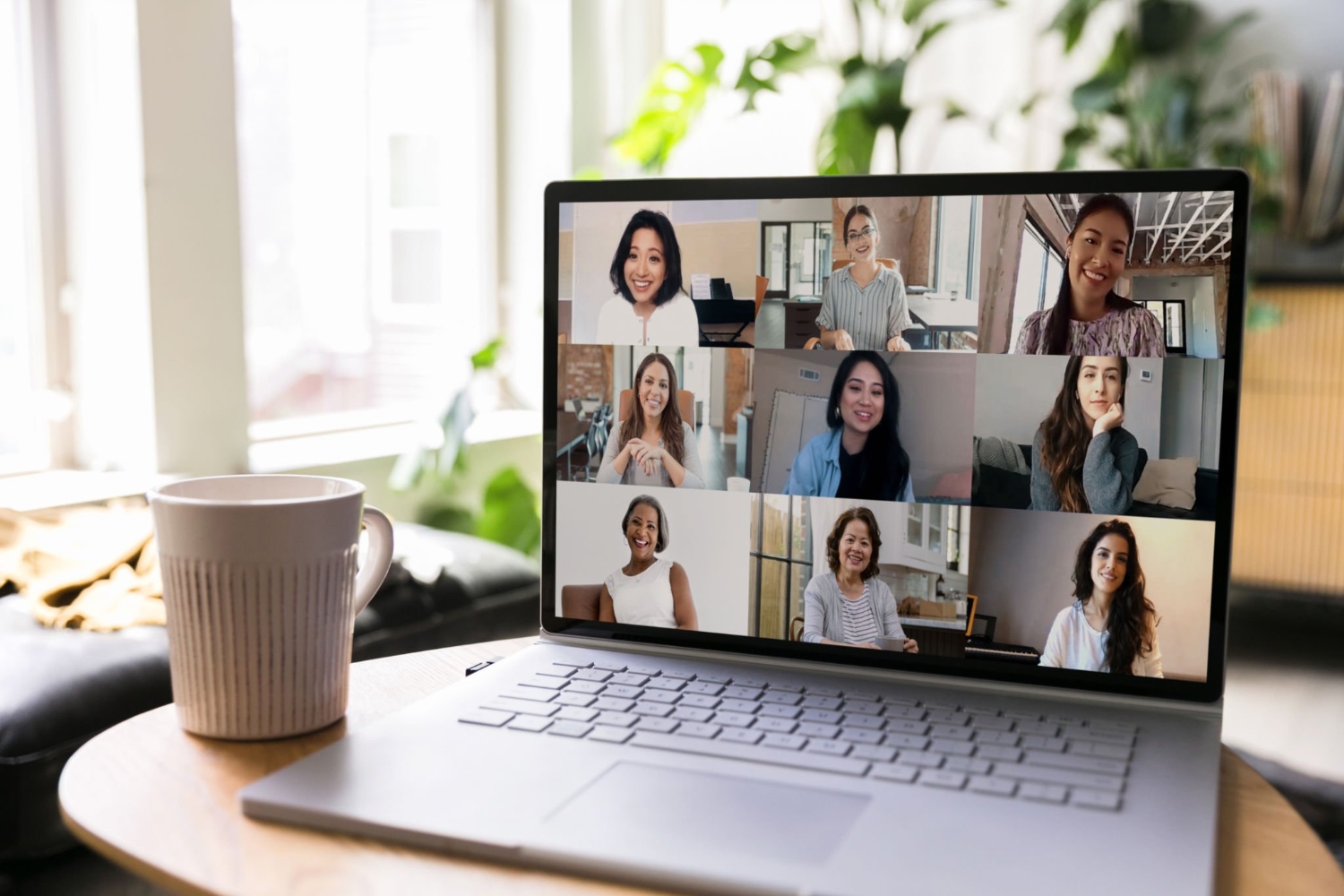 Group of business women use teleconferencing for meeting